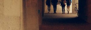 People walking in a tunnel in the wake of Bill C36