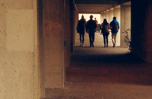 People walking in a tunnel in the wake of Bill C36