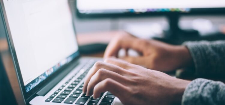 Going online: What we want you to know about our workshops Photo of a persons hands typing on a laptop computer